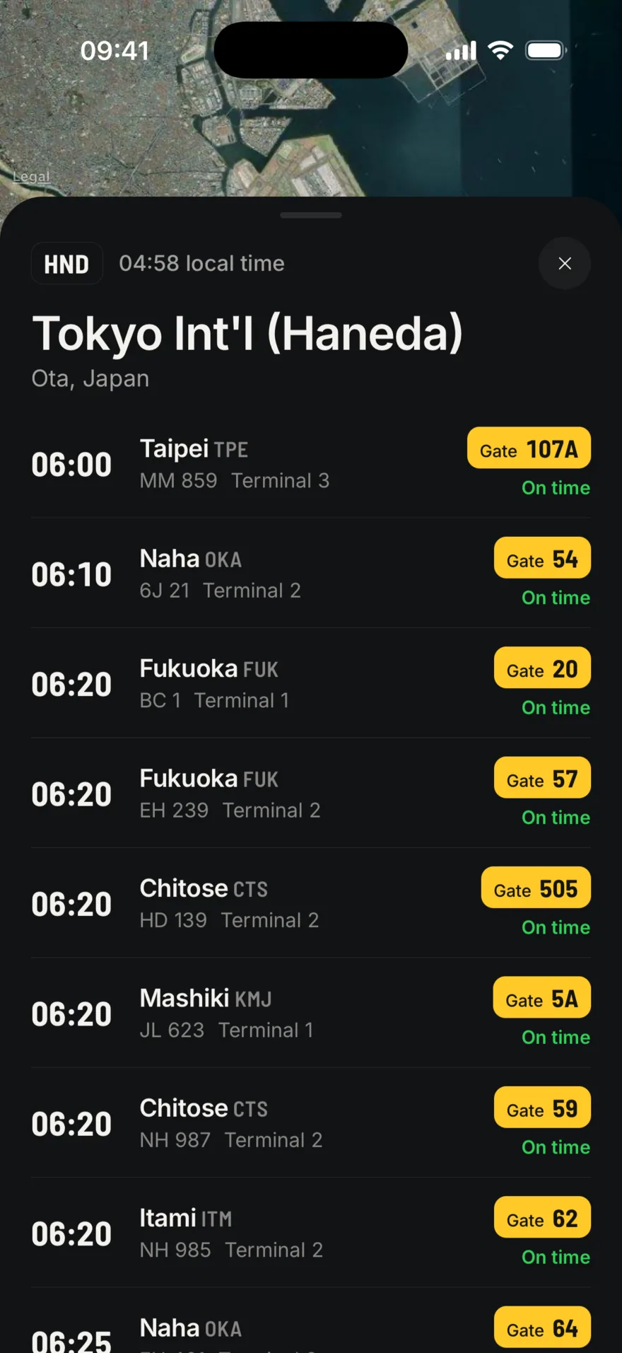 The departures board at Tokyo Haneda: flights to Taipei, Naha, Fukuoka, Chitose and Itami, each with its gate on a yellow sign and marked on time.