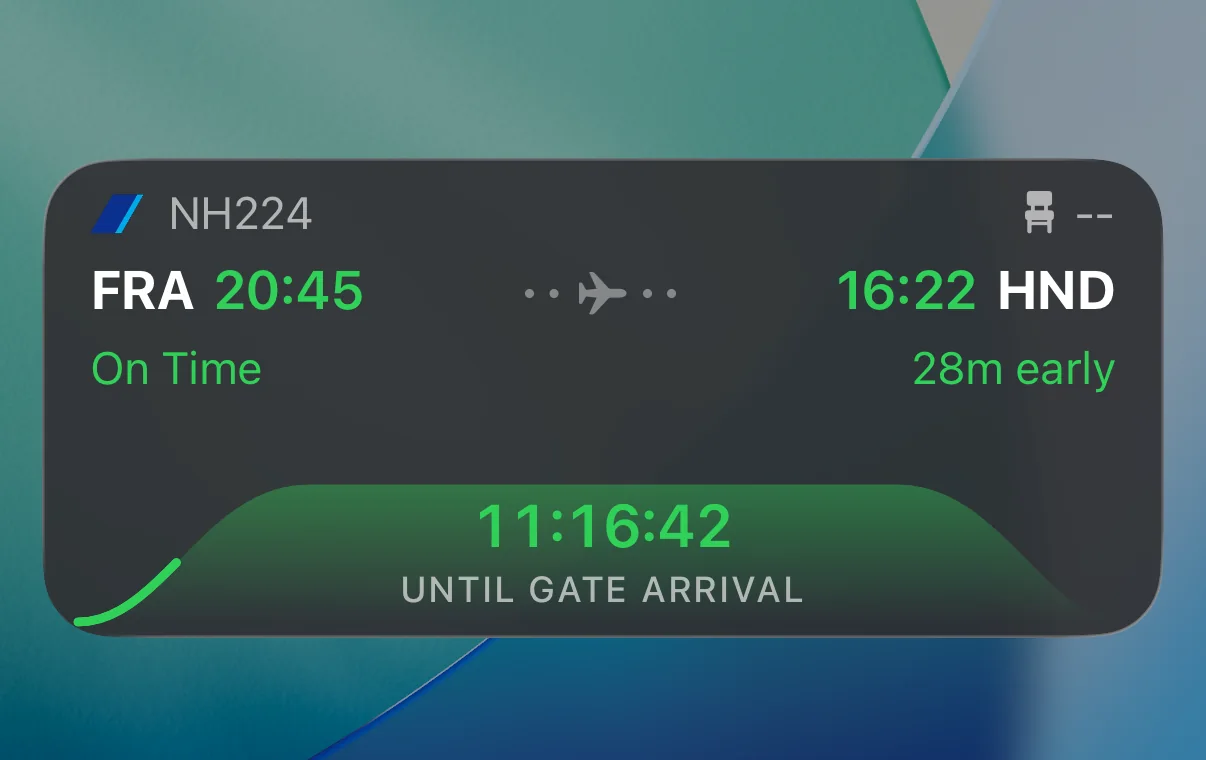 The Live Activity on the Lock Screen counting down 11 hours 16 minutes to gate arrival in Tokyo.